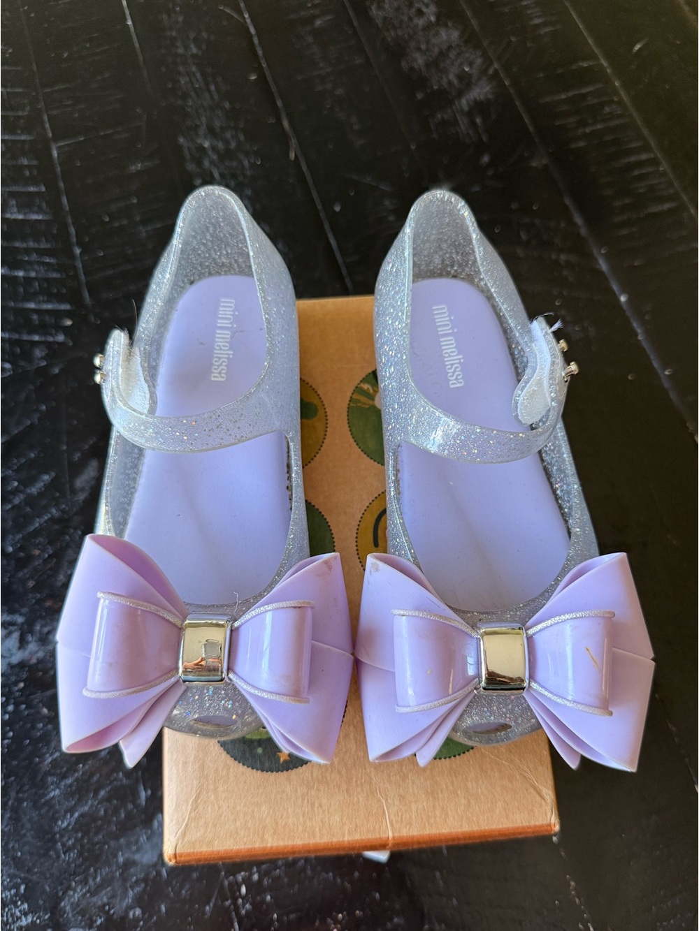 Mini Melissa Silver Glitter Mary Janes with Lavender Bows